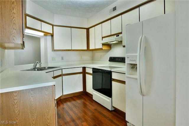 3406 Ivy Hill Cir Unit B, Cortland, OH 44410 - kitchen with white fridge with ice dispenser, range with electric cooktop, under cabinet range hood, dark wood-style flooring, and light countertops