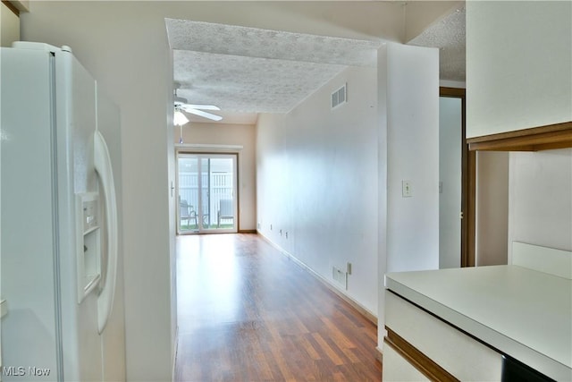 3406 Ivy Hill Cir Unit B, Cortland, OH 44410 - kitchen featuring white refrigerator with ice dispenser, a textured ceiling, ceiling fan, wood finished floors, and light countertops