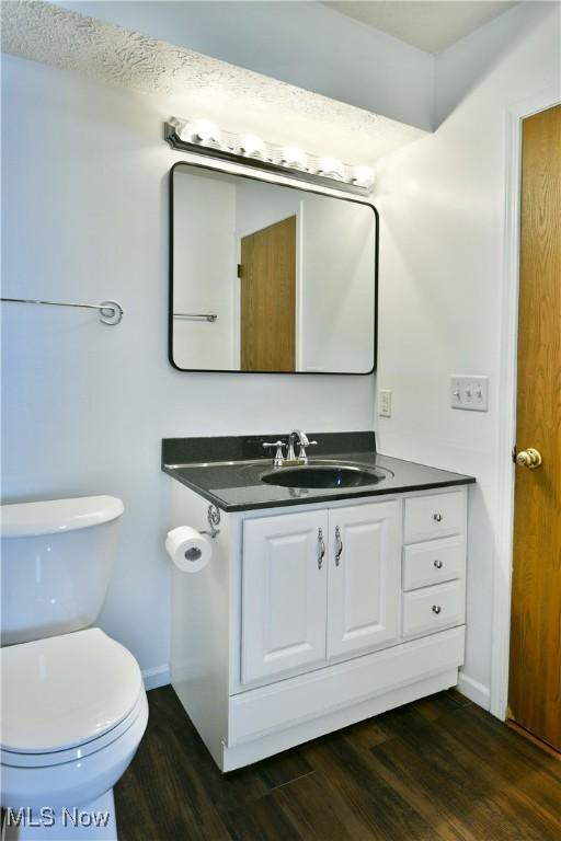 3406 Ivy Hill Cir Unit B, Cortland, OH 44410 - half bath featuring wood finished floors and vanity