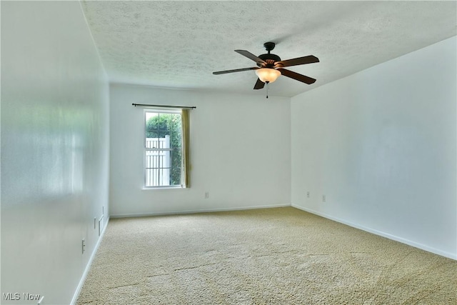 3406 Ivy Hill Cir Unit B, Cortland, OH 44410 - empty room with a ceiling fan, a textured ceiling, and carpet floors
