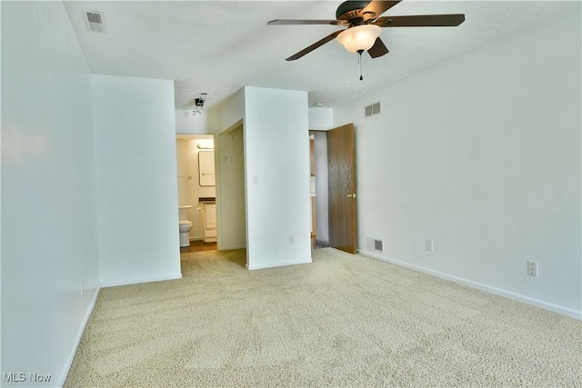 3406 Ivy Hill Cir Unit B, Cortland, OH 44410 - unfurnished bedroom featuring carpet flooring, connected bathroom, and a ceiling fan