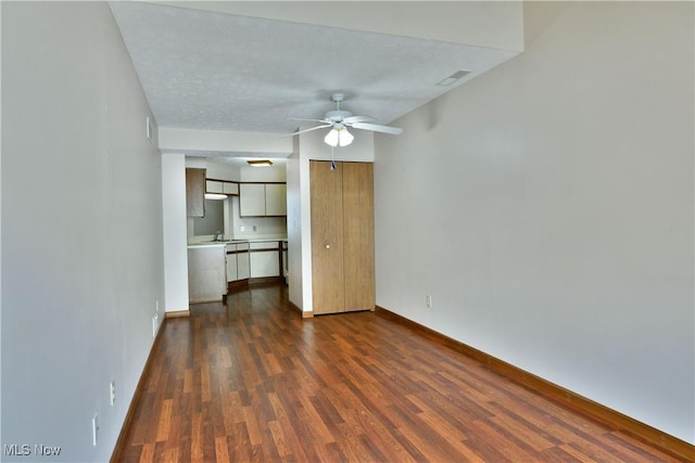 3406 Ivy Hill Cir Unit B, Cortland, OH 44410 - unfurnished living room featuring ceiling fan and dark wood finished floors