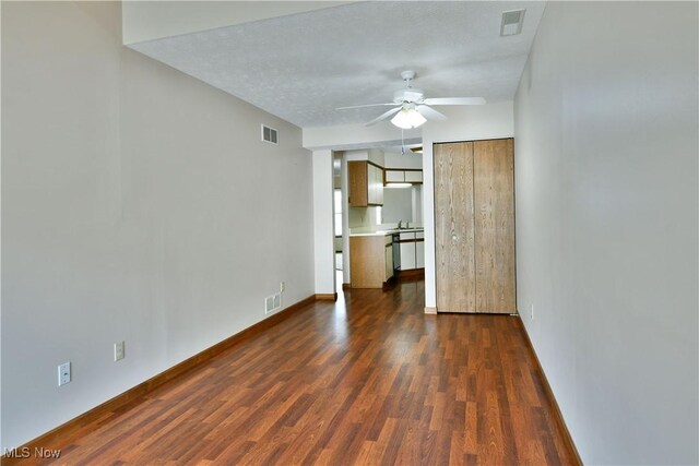 3406 Ivy Hill Cir Unit B, Cortland, OH 44410 - unfurnished bedroom with dark wood-style flooring and a ceiling fan