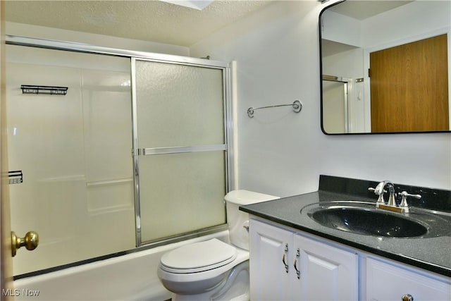 3406 Ivy Hill Cir Unit B, Cortland, OH 44410 - bathroom with vanity, bath / shower combo with glass door, and a textured ceiling