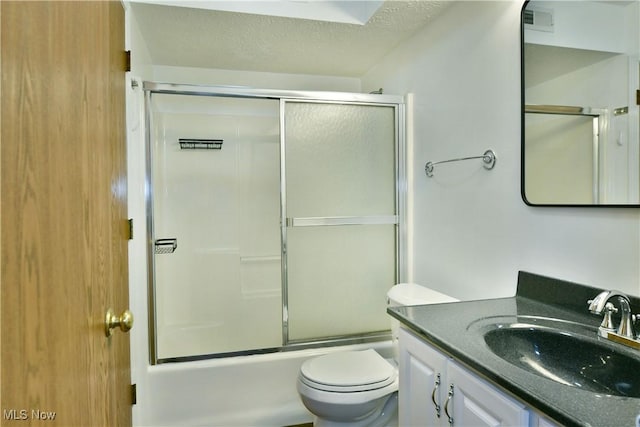 3406 Ivy Hill Cir Unit B, Cortland, OH 44410 - bathroom featuring vanity, enclosed tub / shower combo, and a textured ceiling