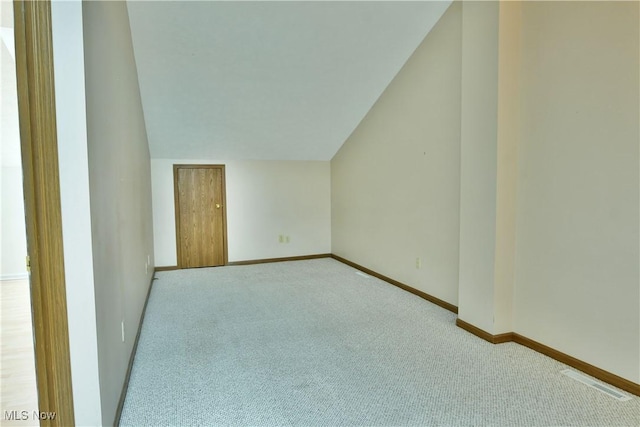 3406 Ivy Hill Cir Unit B, Cortland, OH 44410 - carpeted spare room featuring baseboards and lofted ceiling