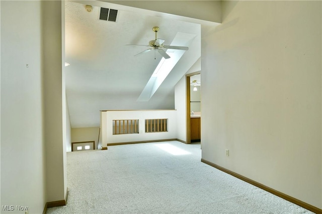 3406 Ivy Hill Cir Unit B, Cortland, OH 44410 - bonus room featuring a skylight, carpet flooring, a ceiling fan, and vaulted ceiling