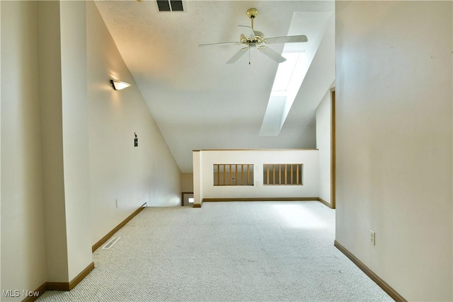 3406 Ivy Hill Cir Unit B, Cortland, OH 44410 - bonus room featuring a ceiling fan, carpet flooring, vaulted ceiling, and a skylight