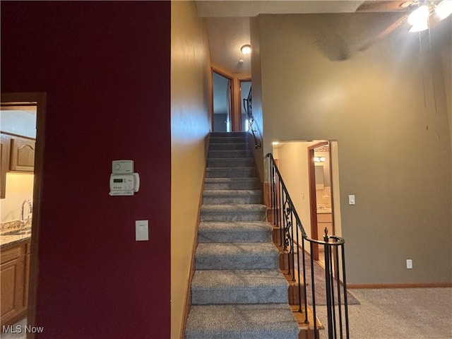 25320 Clubside Dr Unit 6, North Olmsted, OH 44070 - stairway featuring carpet flooring and a ceiling fan