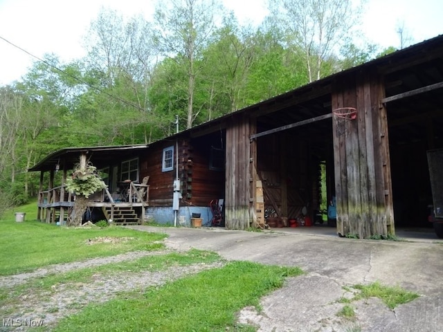 1389 Middle Fork Rd, Millstone, WV 25261 - view of front facade with log exterior and a front lawn
