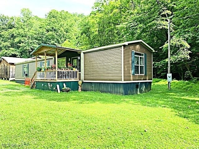 1389 Middle Fork Rd, Millstone, WV 25261 - view of side of property featuring a yard