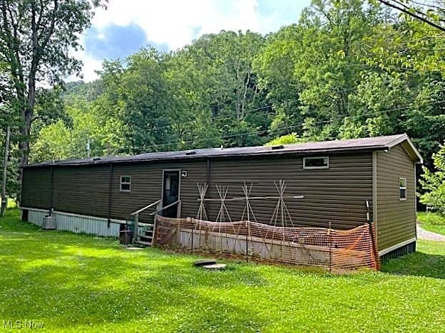 1389 Middle Fork Rd, Millstone, WV 25261 - rear view of property featuring a lawn