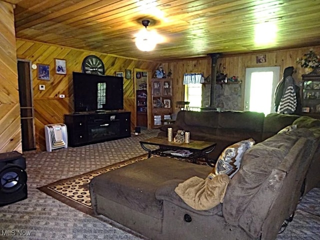 1389 Middle Fork Rd, Millstone, WV 25261 - carpeted living room featuring wood walls and wood ceiling