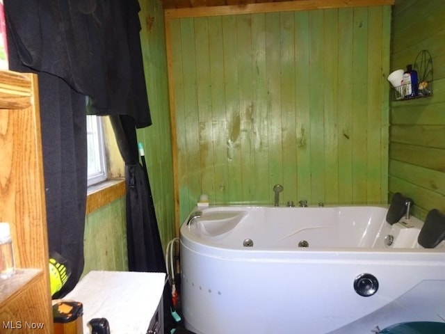 1389 Middle Fork Rd, Millstone, WV 25261 - bathroom featuring wood walls and a whirlpool tub