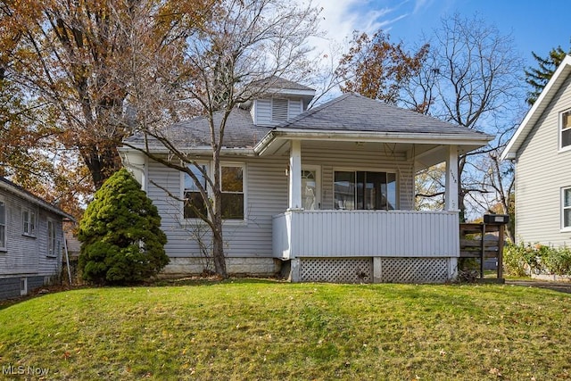 1258 Lily St, Akron, OH 44301 - bungalow-style home with a front lawn, a porch, and a shingled roof