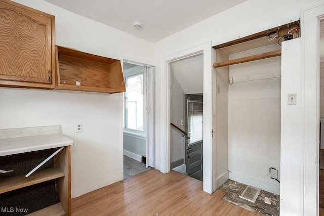 1258 Lily St, Akron, OH 44301 - laundry area with light wood-type flooring and baseboards