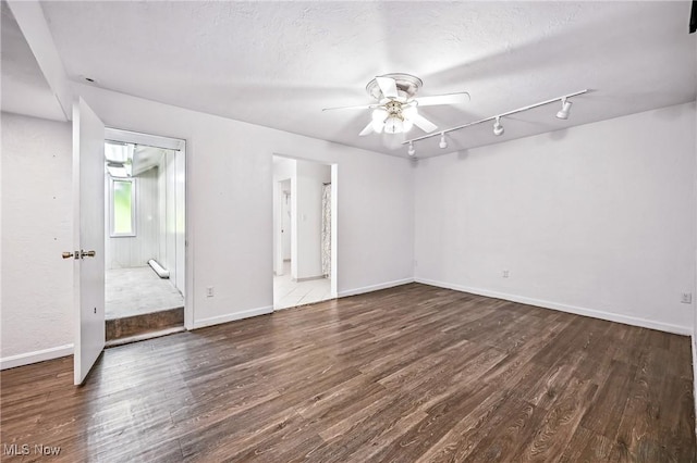 1130 Dairy Ln, East Liverpool, OH 43920 - unfurnished room featuring wood finished floors, a ceiling fan, and rail lighting