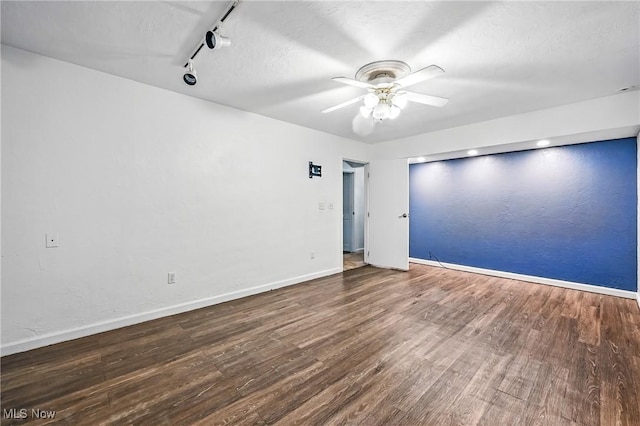 1130 Dairy Ln, East Liverpool, OH 43920 - unfurnished room featuring wood finished floors, a ceiling fan, rail lighting, and a textured ceiling