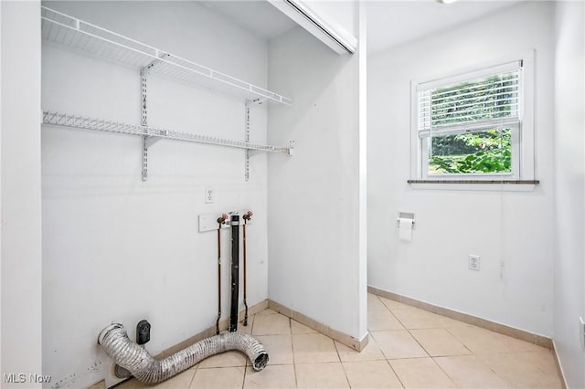 1130 Dairy Ln, East Liverpool, OH 43920 - laundry area with light tile patterned floors and baseboards