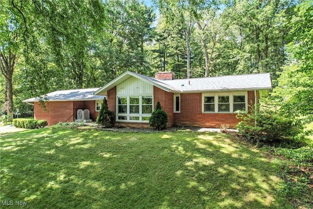 1130 Dairy Ln, East Liverpool, OH 43920 - view of front of house with brick siding, a chimney, and a front yard