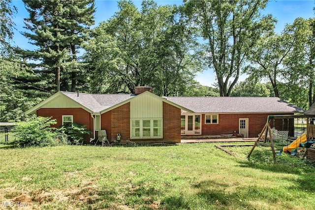 1130 Dairy Ln, East Liverpool, OH 43920 - back of house with a lawn, a chimney, roof with shingles, and brick siding