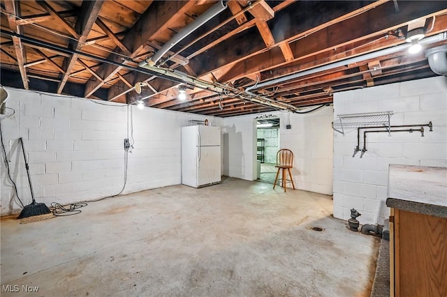 1130 Dairy Ln, East Liverpool, OH 43920 - unfinished basement featuring freestanding refrigerator and concrete block wall