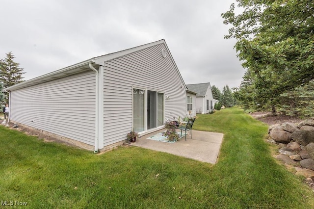 6655 Arbor Way Unit 8, Parma, OH 44134 - view of home's exterior featuring a patio area and a lawn