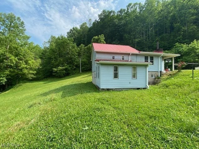 8710 Clay Rd, Left Hand, WV 25251 - view of green lawn with a wooded view