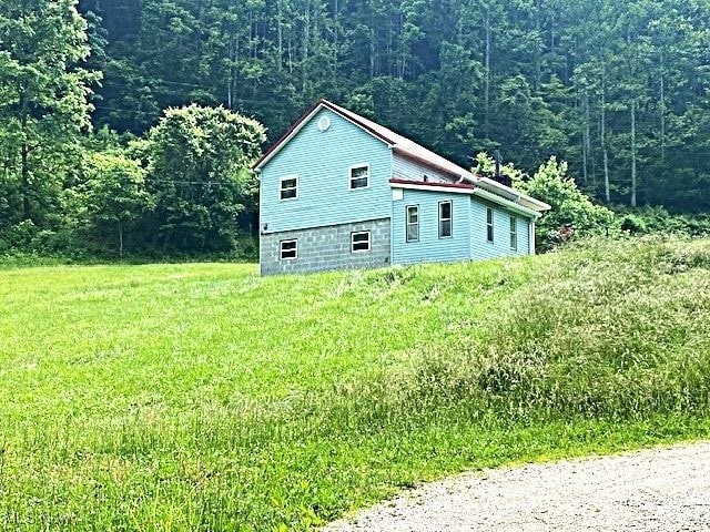 8710 Clay Rd, Left Hand, WV 25251 - view of side of property with a view of trees