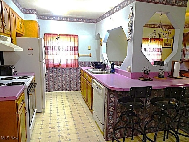 8710 Clay Rd, Left Hand, WV 25251 - kitchen featuring white appliances, light floors, brown cabinets, and extractor fan