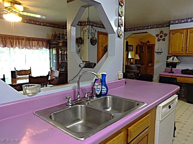 8710 Clay Rd, Left Hand, WV 25251 - kitchen with dishwasher, brown cabinetry, and ceiling fan