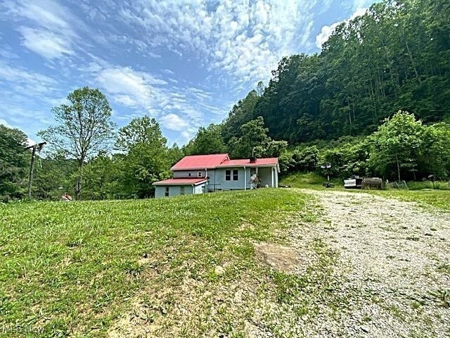 8710 Clay Rd, Left Hand, WV 25251 - view of yard featuring a forest view