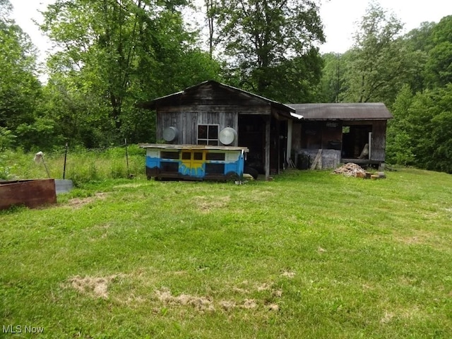 8710 Clay Rd, Left Hand, WV 25251 - view of outbuilding featuring a view of trees