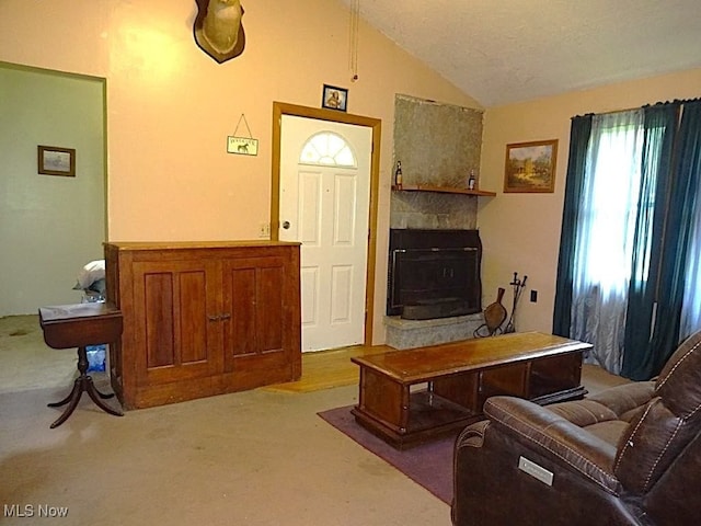 8710 Clay Rd, Left Hand, WV 25251 - living area with carpet, lofted ceiling, and a large fireplace
