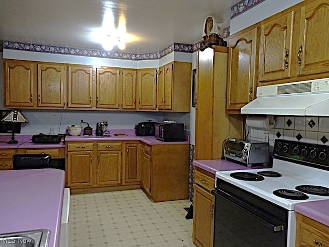 8710 Clay Rd, Left Hand, WV 25251 - kitchen featuring electric range oven, under cabinet range hood, brown cabinetry, light countertops, and light floors