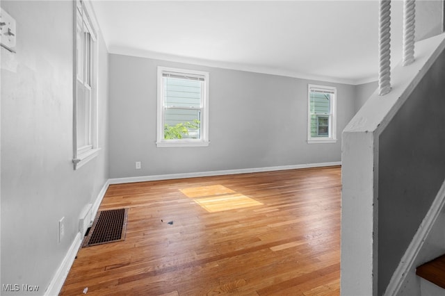 19501 Libby Rd, Maple Heights, OH 44137 - unfurnished living room with wood finished floors and baseboards
