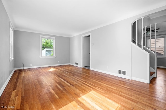 19501 Libby Rd, Maple Heights, OH 44137 - spare room with stairs and light wood-type flooring