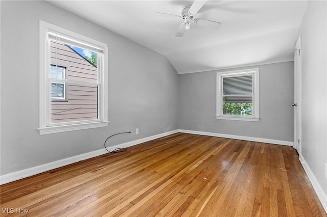 19501 Libby Rd, Maple Heights, OH 44137 - empty room featuring vaulted ceiling, light wood-style floors, healthy amount of natural light, and a ceiling fan