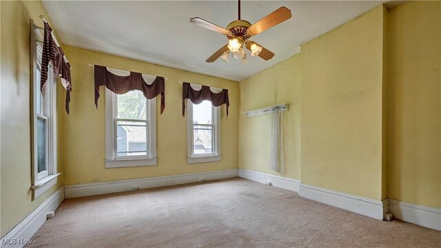 606 N Wooster Ave, Dover, OH 44622 - carpeted empty room with a ceiling fan and baseboards