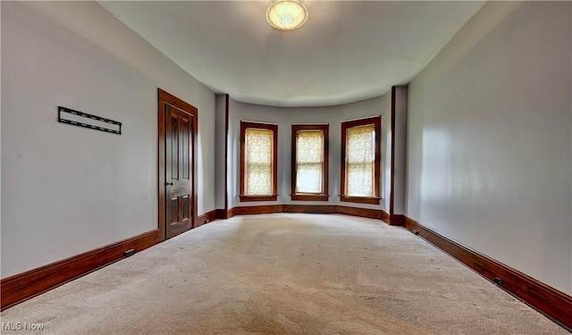 606 N Wooster Ave, Dover, OH 44622 - spare room featuring carpet floors and baseboards