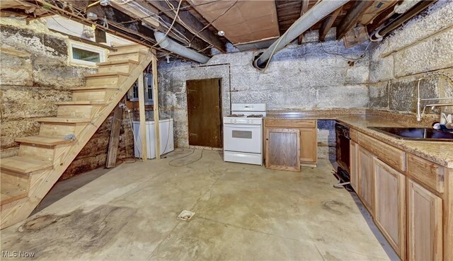 606 N Wooster Ave, Dover, OH 44622 - unfinished below grade area with a sink and stairway