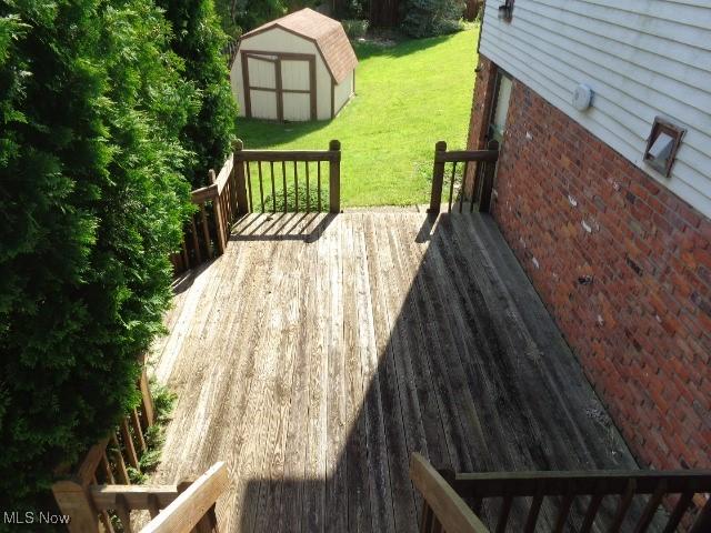 4326 Wood Thrush Dr, Parma, OH 44134 - wooden terrace with a shed and a lawn