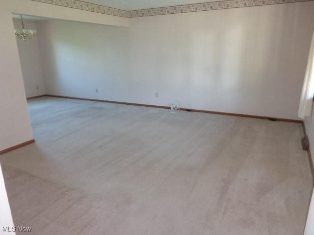4326 Wood Thrush Dr, Parma, OH 44134 - spare room featuring baseboards and light carpet