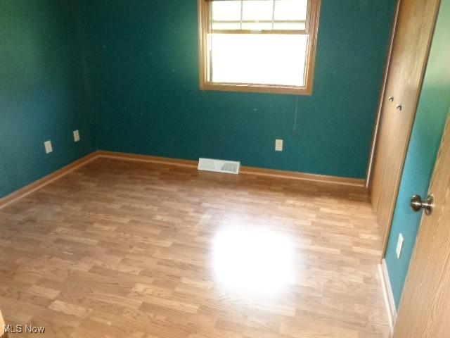 4326 Wood Thrush Dr, Parma, OH 44134 - spare room with wood finished floors