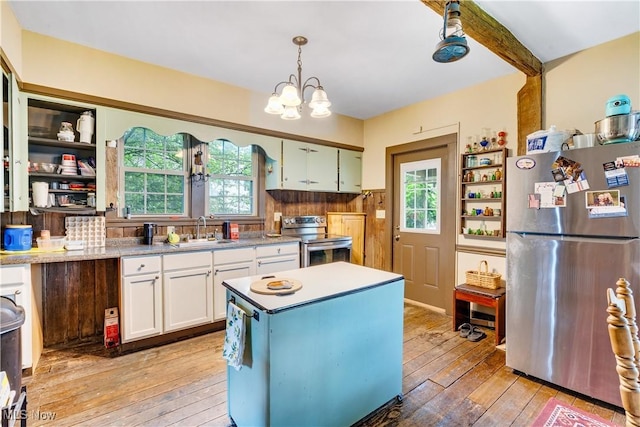 337 Youngstown Kingsville Rd SE, Vienna, OH 44473 - kitchen with stainless steel appliances, light wood-style flooring, white cabinetry, and healthy amount of natural light