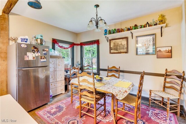 337 Youngstown Kingsville Rd SE, Vienna, OH 44473 - dining space with a chandelier and wood finished floors