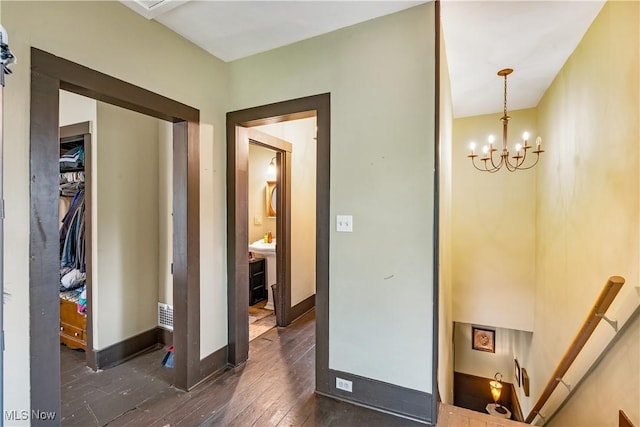 337 Youngstown Kingsville Rd SE, Vienna, OH 44473 - hall with hardwood / wood-style floors, a chandelier, and an upstairs landing