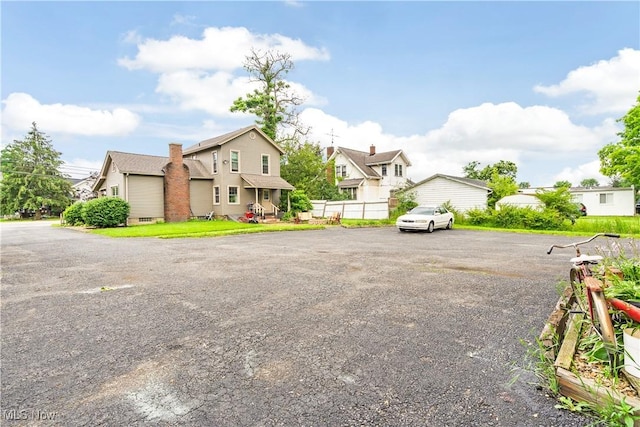 337 Youngstown Kingsville Rd SE, Vienna, OH 44473 - view of front of house with a residential view and a chimney