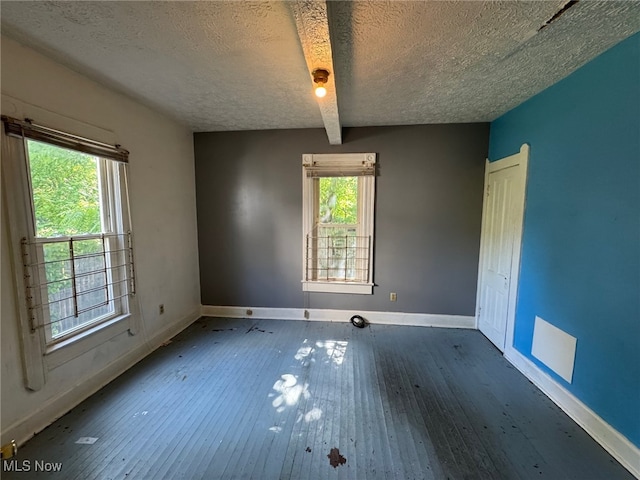 1185 E 74th St, Cleveland, OH 44103 - spare room featuring a textured ceiling and hardwood / wood-style floors