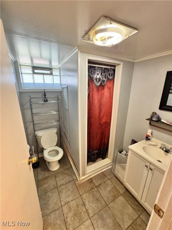 6033 E 135th St, Garfield Heights, OH 44125 - full bath with vanity, a stall shower, tile patterned flooring, and crown molding